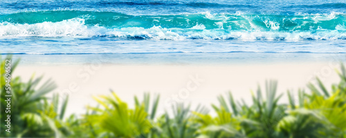 Photography idyllic tropical sand beach scene with blue water wave and blurry green palm lea