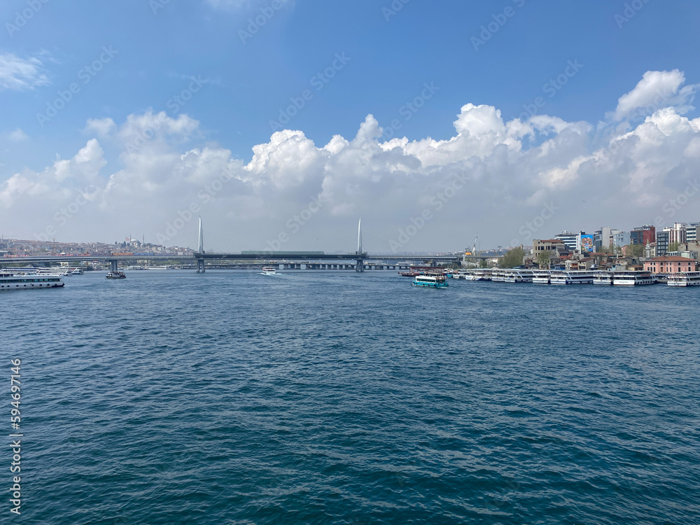 A view of Suleymaniye Mosque, Bosphorus, City line ferries and Touristic sightseeing ships passing through  from Galata bridge, Istanbul Turkey