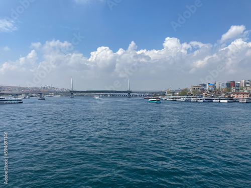 Fototapeta Naklejka Na Ścianę i Meble -  A view of Suleymaniye Mosque, Bosphorus, City line ferries and Touristic sightseeing ships passing through  from Galata bridge, Istanbul Turkey