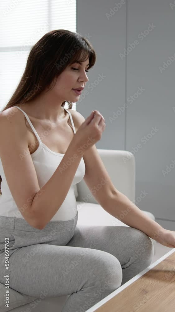 Pregnant Muslim Woman Taking Folic Acid Pill Pregnant Muslim Woman Taking Folic Acid Pill