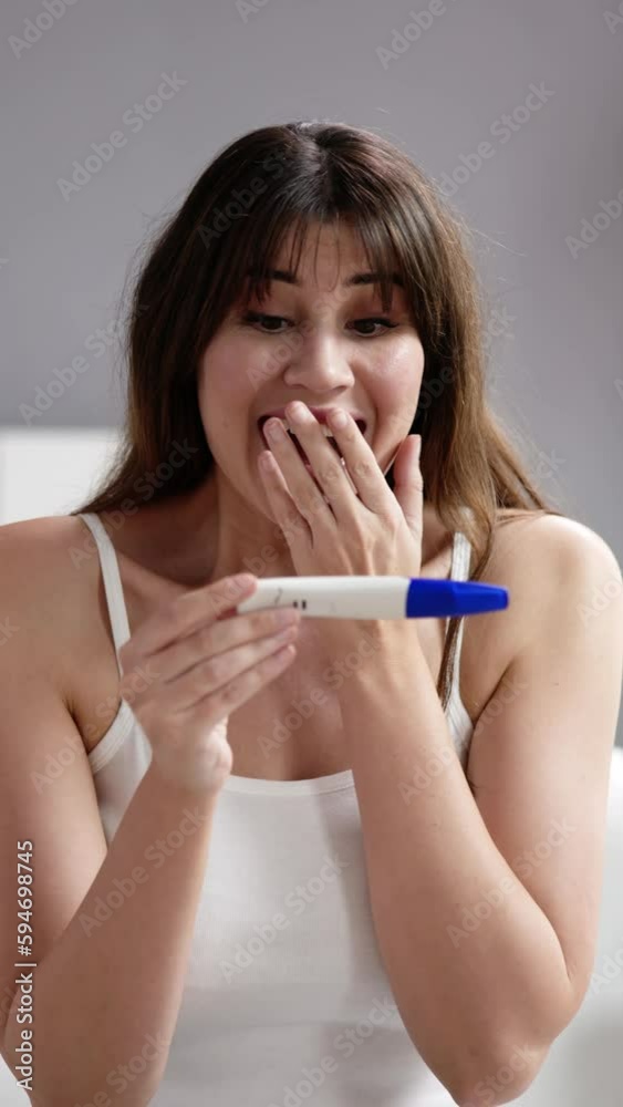 Close-up Of Smiling Woman Holding Pregnancy Close-up Of Smiling Woman Holding Pregnancy