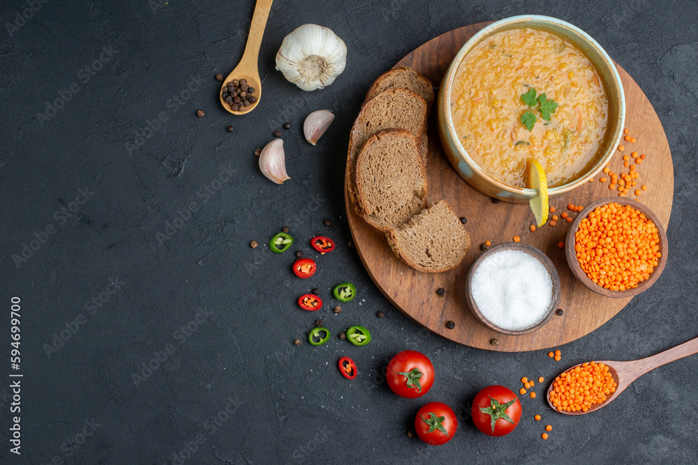 top view lentil soup with salt raw lentils and dark bread loafs on dark surface diner dinner horizontal food colourful meal dish bread top view lentil soup with salt raw lentils and dark bread loafs on dark surface diner dinner horizontal food colourful meal dish bread