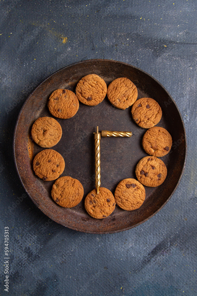 top distant view delicious chocolate cookies inside dark round plate on the dark-grey desk cookie biscuit sweet top distant view delicious chocolate cookies inside dark round plate on the dark-grey desk cookie biscuit sweet