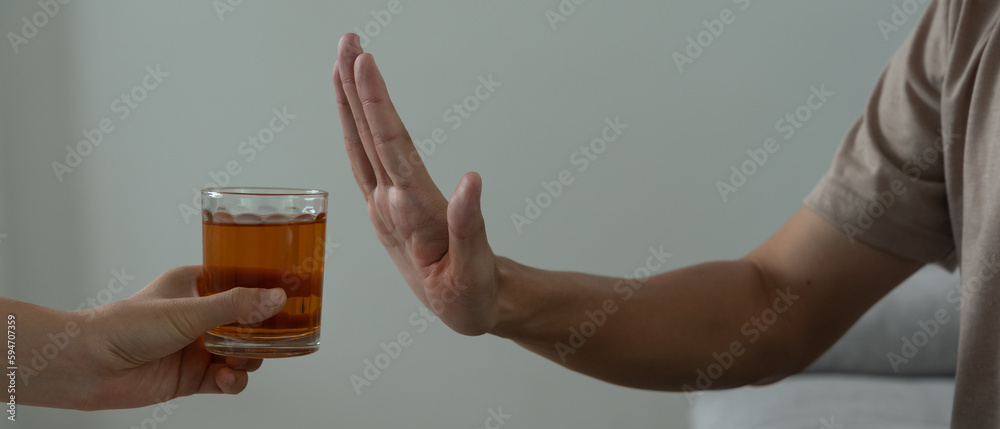 man refuses say no and avoid to drink an alcohol whiskey , stopping hand sign male, alcoholism treatment, alcohol addiction, quit booze, Stop Drinking Alcohol. Refuse Glass liquor, unhealthy, reject man refuses say no and avoid to drink an alcohol whiskey , stopping hand sign male, alcoholism treatment, alcohol addiction, quit booze, Stop Drinking Alcohol. Refuse Glass liquor, unhealthy, reject