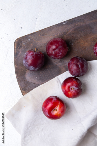 top view red sour plums fresh mellow and ripe on the white desk fruit summer sour round