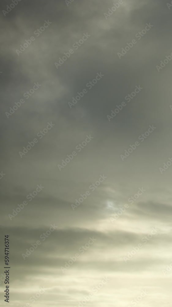Brooding timelapse of dark clouds covering the sky. Vertical video. Brooding timelapse of dark clouds covering the sky. Vertical video.