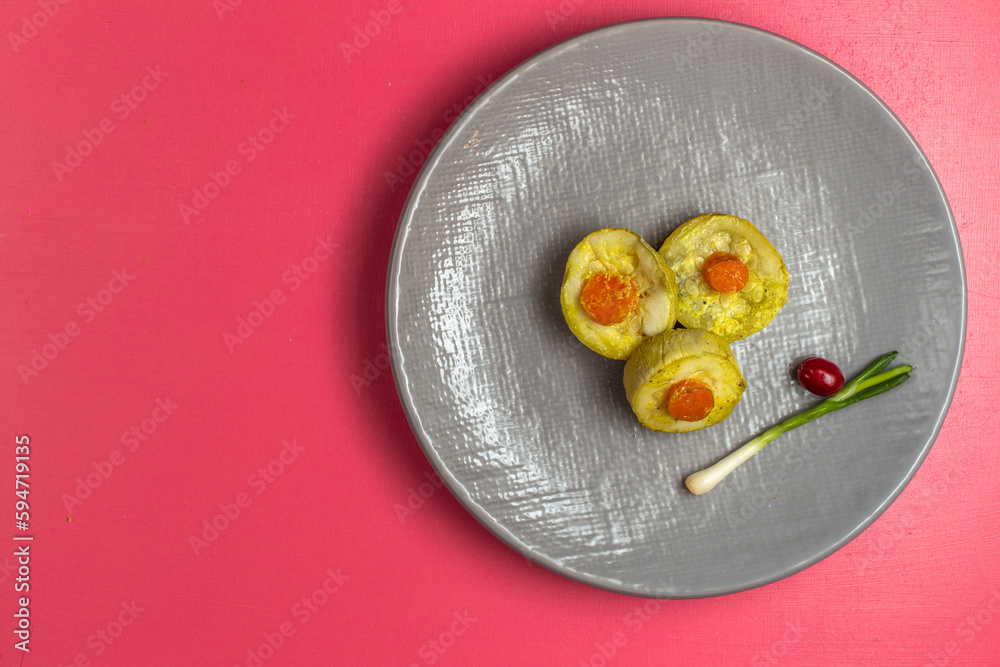 top view cooked squash slices inside grey plate with little green onion on pink desk food vegetable dinner dish color top view cooked squash slices inside grey plate with little green onion on pink desk food vegetable dinner dish color