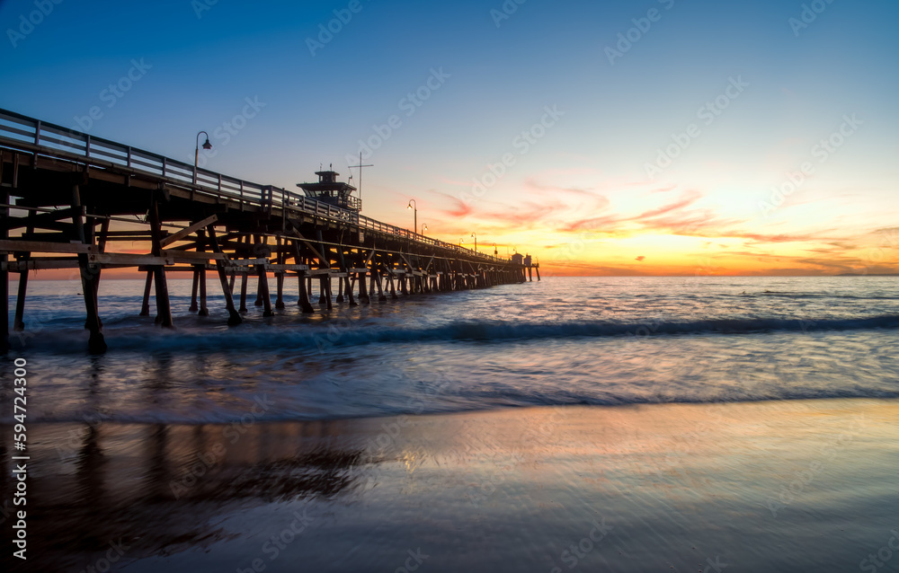 Sunset over the San Clemente pier, Orange County, California, USA.