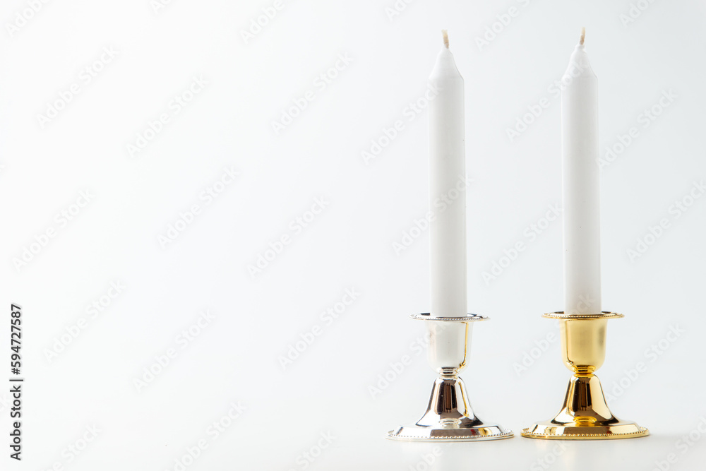 white candles inside elegant candlesticks on white background lamp fire steel metallic white candles inside elegant candlesticks on white background lamp fire steel metallic