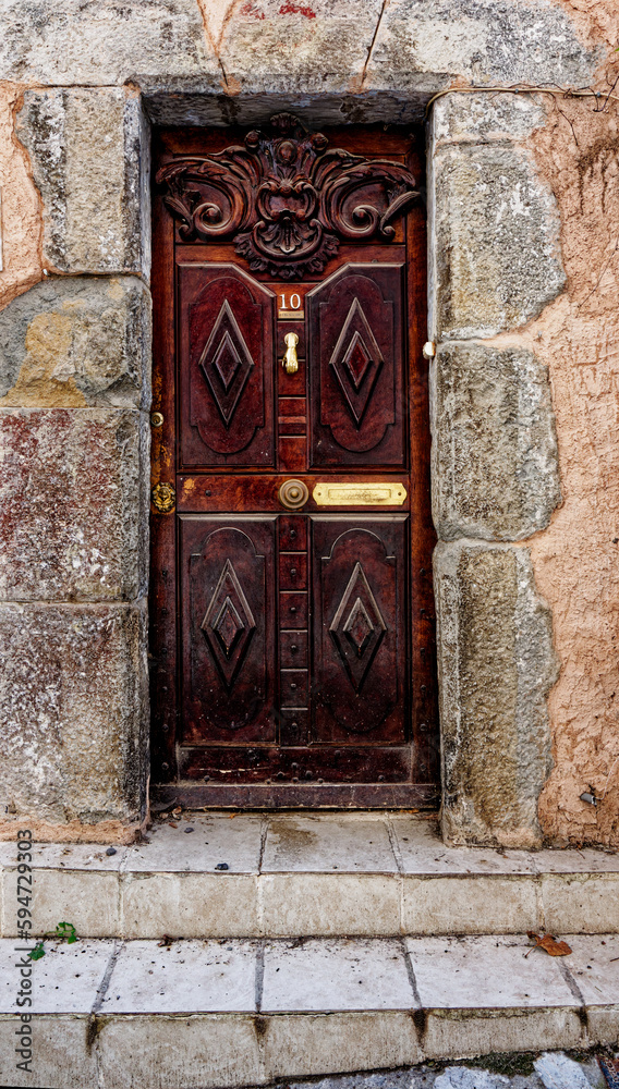 Old door in Entrevaux village, France