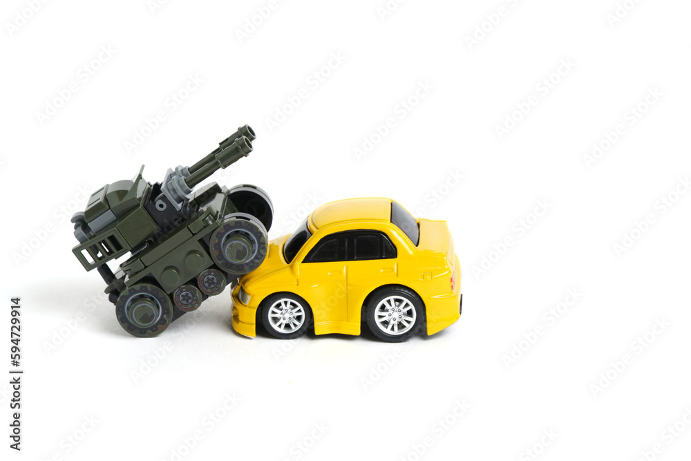 Toy tank runs over passenger car.Concept of war.