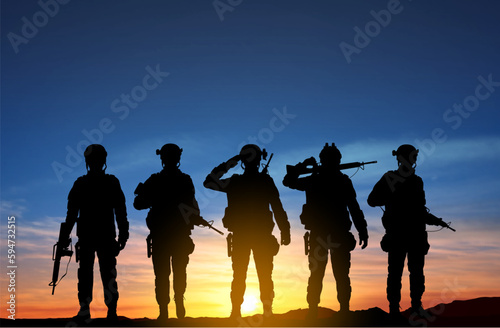Silhouettes of a soliders against the sunset. EPS10 vector