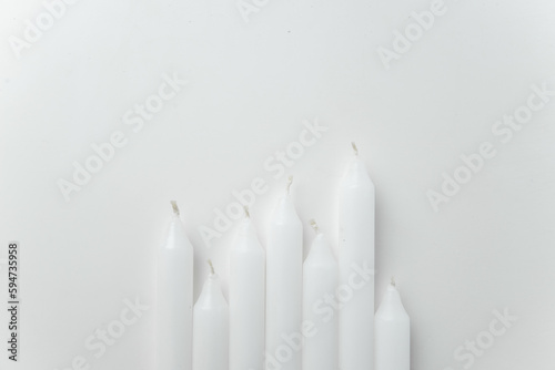 top view white candles on white background funeral fire lamp death flame