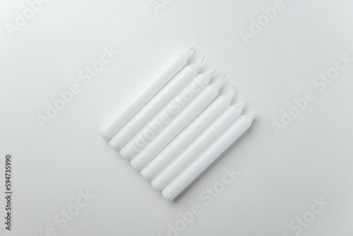 top view white candles on white background lamp death funeral flame