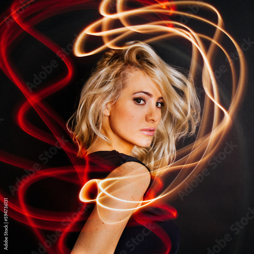 Traces of light near sensual woman