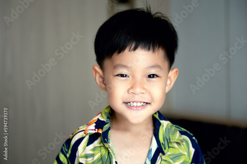 portrait of young asian boy smiling