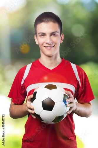 Professional football or soccer player hold the ball in hands © BillionPhotos.com
