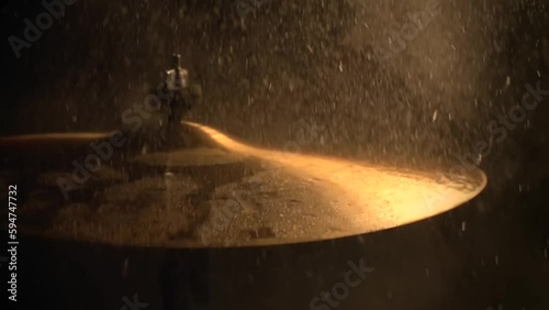 A slow motion of water drops falling on cymbals photo