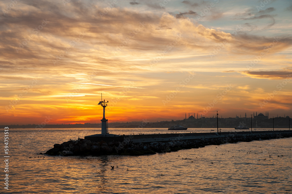 The sunset view on the historical peninsula behind the haydarpaşa breakwater