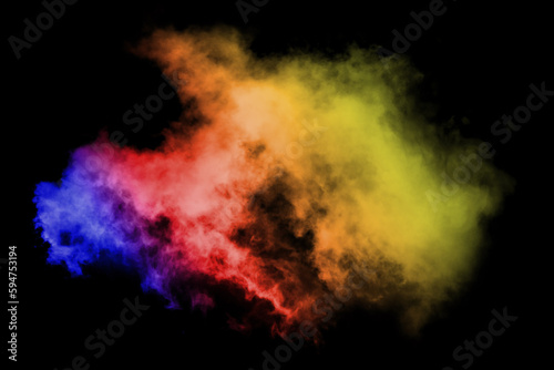 Abstract colored dust explosion on a black background.abstract powder splatted background,Freeze motion of color powder exploding throwing color powder, multicolored glitter texture. © Philip