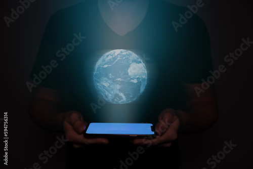 A projection from a mobile phone or tablet with a blue background of the earth.
