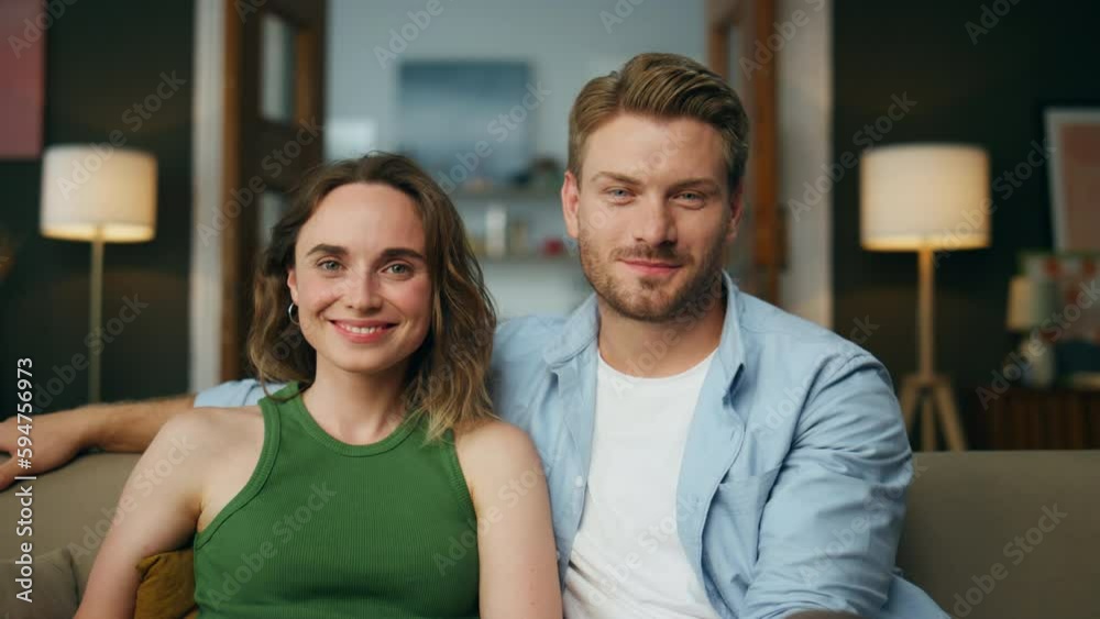 Smiling couple watching comedy sitting couch zoom on. Laughing family together