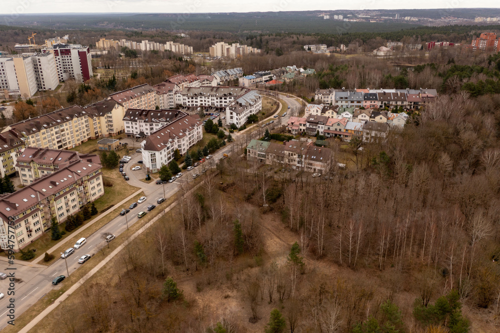 Drone photography of residential area surrounded by forest