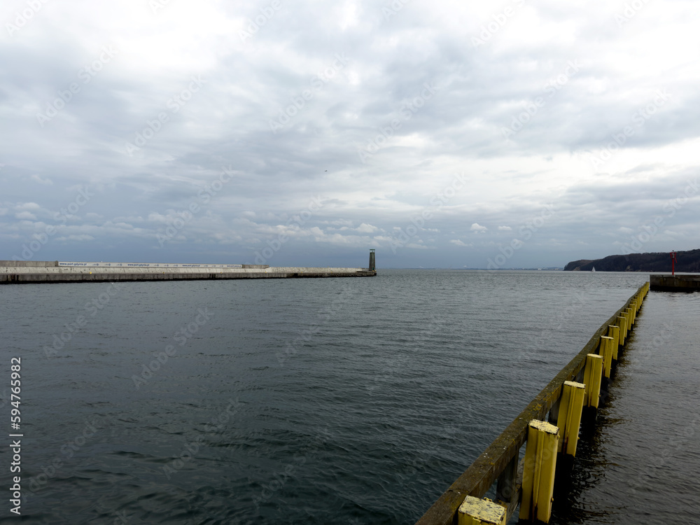View of the sea and the harbor on a cloudy day.