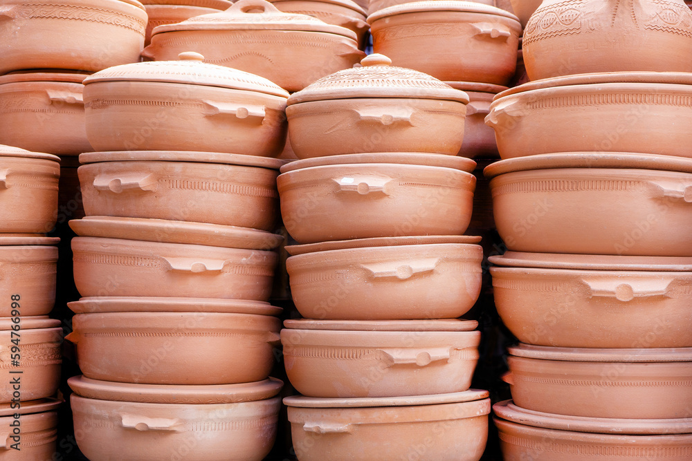 Terracotta ceramic oven bowls. Sale of handmade household utensils at the local market. Terracotta ceramic oven bowls. Sale of handmade household utensils at the local market.