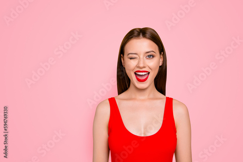 Canvas Print Portrait of foxy lovely and funny girl winking with one eye and having beaming s