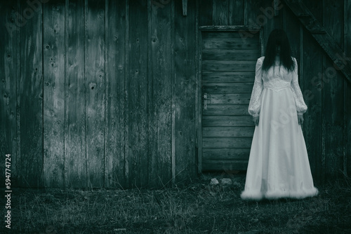 Horror scene of woman in white dress