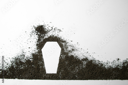 top view of coffin shape with dark soil on white background grim reaper funeral death