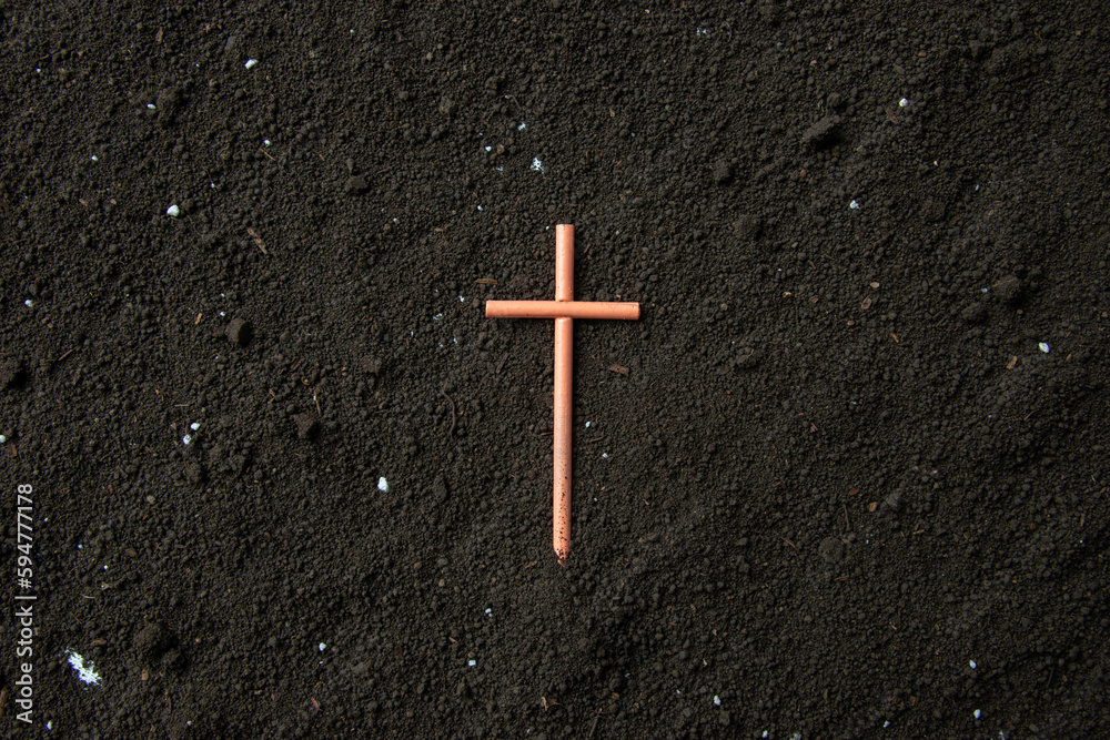 top view of cross on soil death grim reaper funeral