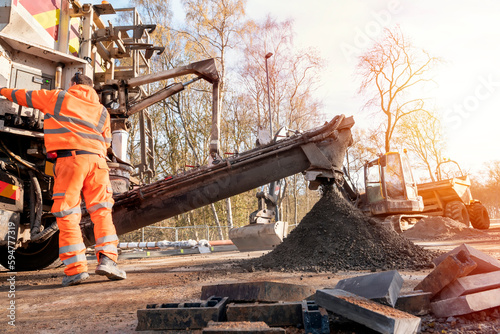 Fotografi Concrete delivered on the construction site and offloaded from a volumetric conc