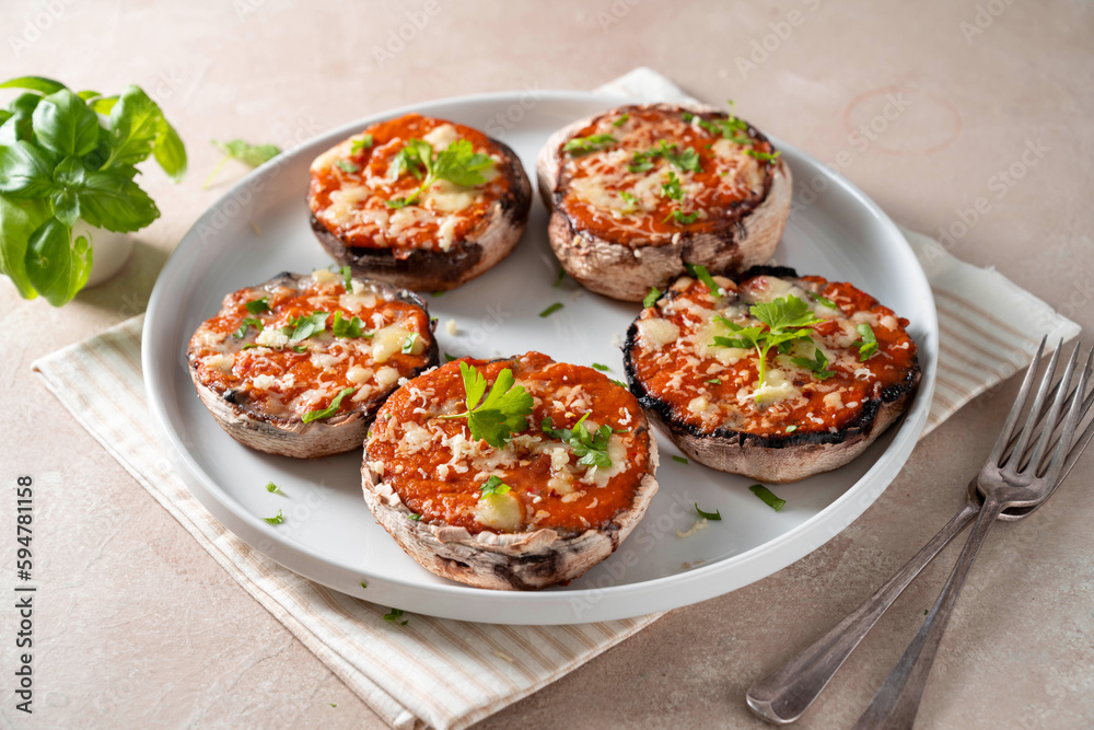 Stuffed champignon portobello stuffed with tomatoes sauce and cheese. 