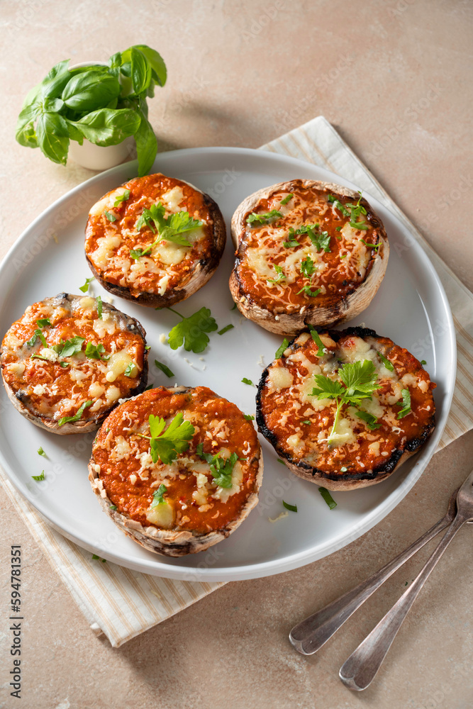 Stuffed champignon portobello stuffed with tomatoes sauce and cheese. Stuffed champignon portobello stuffed with tomatoes sauce and cheese.