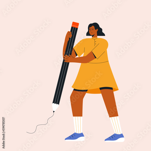 Student standing with pencil