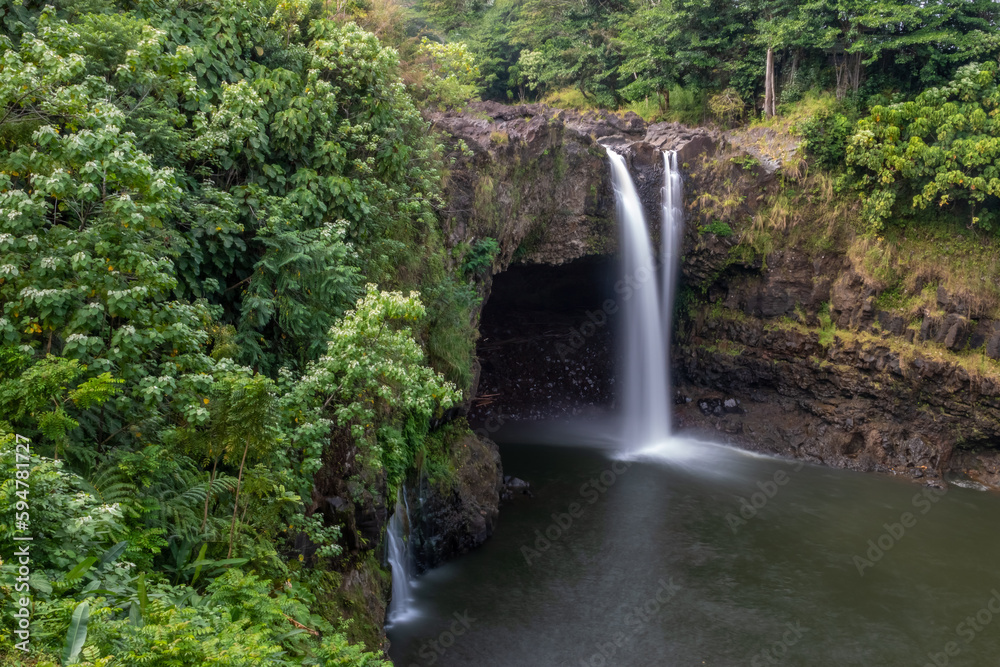 Rainbow (Waianuenue) Falls is a waterfall, Hilo, Hawaii, USA. The Wailuku River rushes into a large pool below.