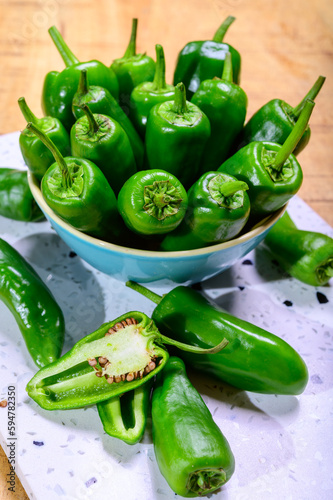 Fresh green mild padron pepper pementos, ready for grill or to be fried with olive oil, traditional snack in Galicia, Spain photo