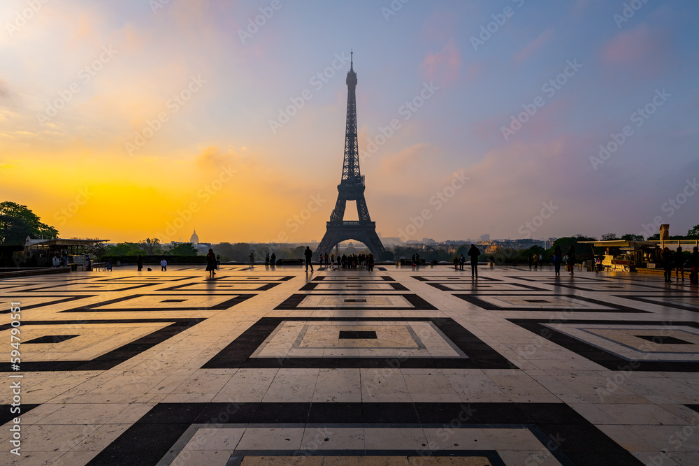 Eiffel Tower, French: Tour Eiffel, silhouette at dawn. View from Trocadero Square with geometrical marble pavement. Paris, France
