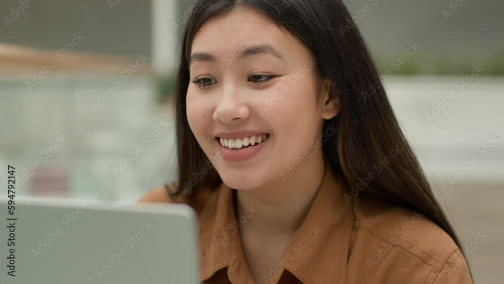 Asian chinese woman talking laptop online video meeting internet communication happy smiling female businesswoman student girl talk in virtual class e-learning webcam application videoconference call