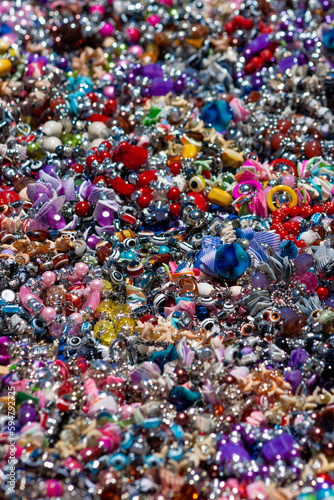 picture-filling mass of jewelry and decorative stones and ornaments in a motley heap