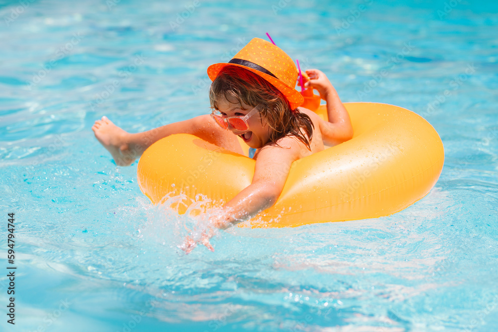 Child floating in pool. Child relaxing in pool, drink summer cocktail