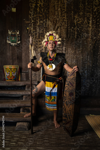 A Borneo man showcasing the beauty of her culture through stunning traditional clothing