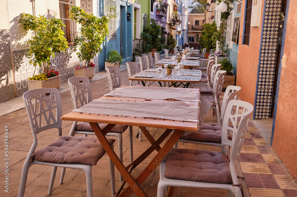 Historic center of the old town of Calpe.Calpe town with colorful houses and restaurant terraces.A place to eat in restaurants on a terrace street.Spain Historic center of the old town of Calpe.Calpe town with colorful houses and restaurant terraces.A place to eat in restaurants on a terrace street.Spain