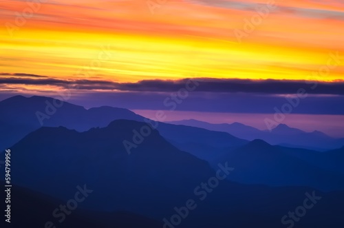 Mountain landscape in autumn evening at sunset. Outstanding view of the mountain ridges in Tatras National Park in Poland during the sun goes down. Photo taken in Giewont Peak, Poland. © shadowmoon30