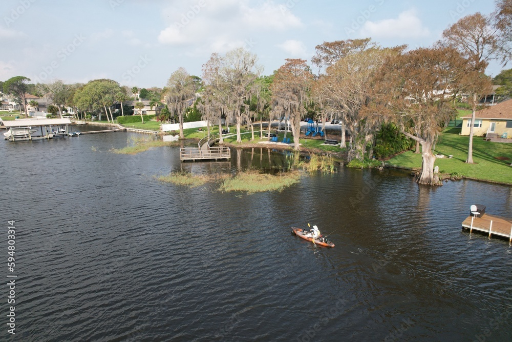 A drone photograph of Lake Tarpon in Tarpon Springs, Florida, of a community park in a natural setting.