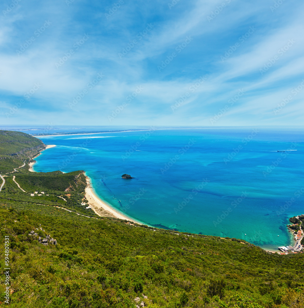 Summer sea coastal landscape with sandy Portinho beach. Top view from Nature Park of Arrabida in Setubal, Portugal.