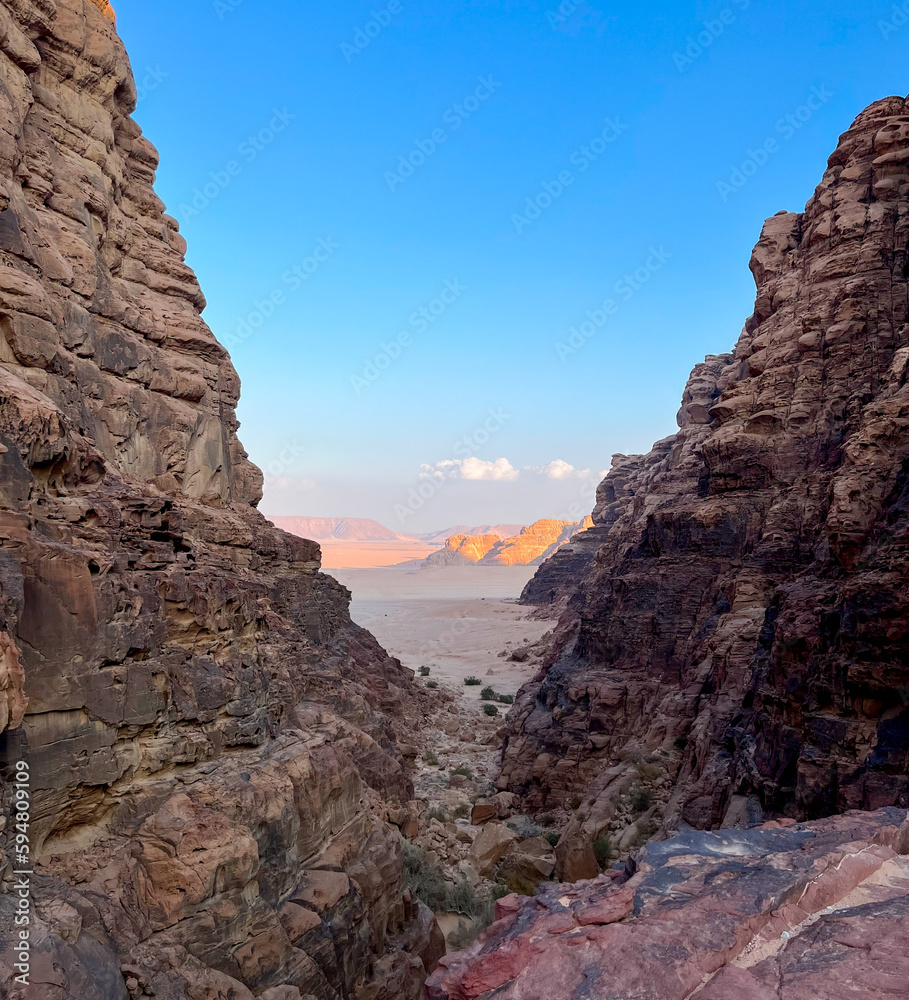 Glimpse between the mountains of the Wadi Rum desert in Jordan.