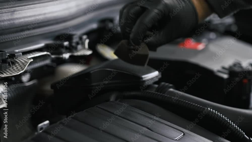 Engine datailing video. Close shot. Gloved hand wiping the engine with a sponge. High quality 4k footage Engine datailing video. Close shot. Gloved hand wiping the engine with a sponge. High quality 4k footage